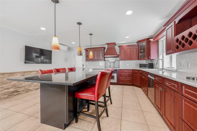 29 Fairway Dr, Rocky Point, NY 11778 - kitchen featuring reddish brown cabinets, light tile patterned flooring, stainless steel appliances, and custom range hood