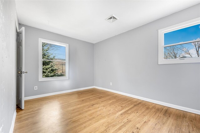 29 Fairway Dr, Rocky Point, NY 11778 - empty room featuring baseboards, light wood-style flooring, and visible vents