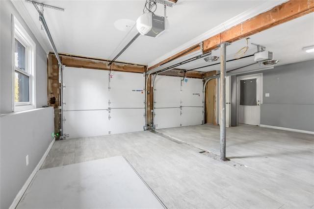 29 Fairway Dr, Rocky Point, NY 11778 - garage with a garage door opener and baseboards
