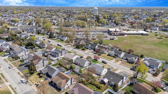 birds eye view of property with a residential view
