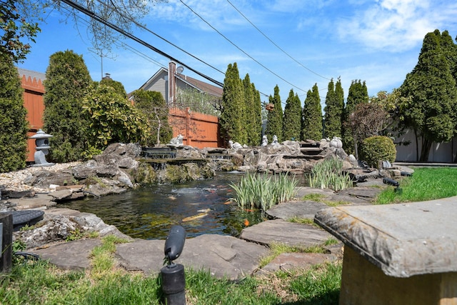 exterior space with a small pond
