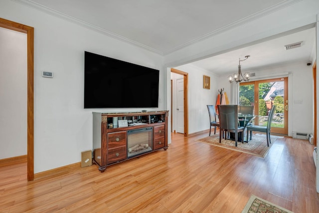 living room featuring a baseboard radiator, visible vents, a chandelier, light wood-type flooring, and ornamental molding