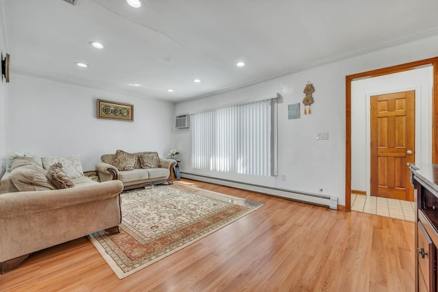 living room with a baseboard heating unit, recessed lighting, a wall mounted air conditioner, and light wood-type flooring