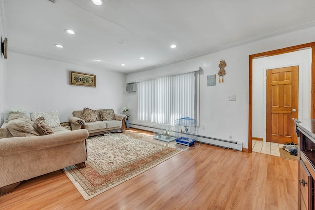 living room with recessed lighting, ornamental molding, a baseboard heating unit, and light wood finished floors