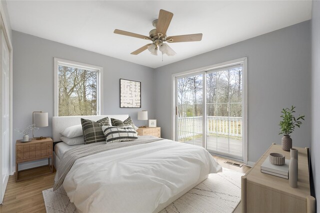 280 Shinnecock Hills Rd, Southampton, NY 11968 - bedroom featuring visible vents, multiple windows, light wood-style flooring, and access to exterior