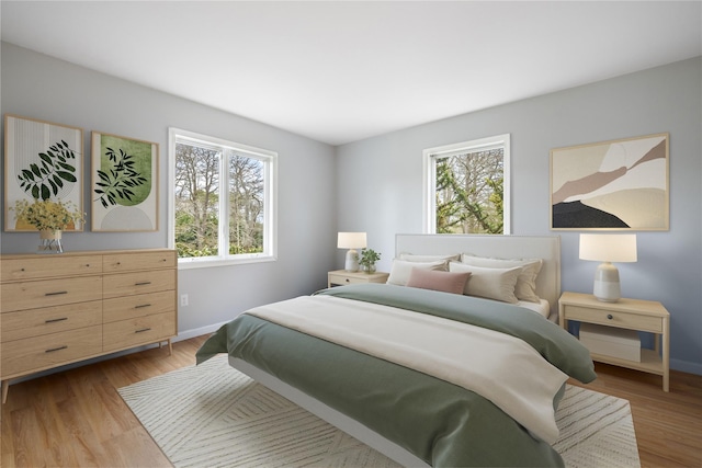 280 Shinnecock Hills Rd, Southampton, NY 11968 - bedroom featuring baseboards, multiple windows, and light wood-style flooring