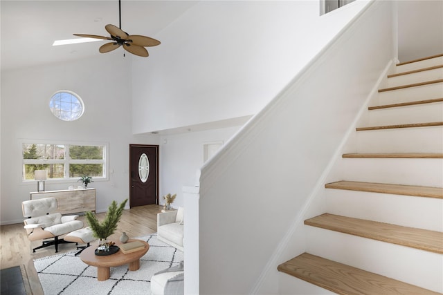 280 Shinnecock Hills Rd, Southampton, NY 11968 - entryway featuring high vaulted ceiling, ceiling fan, wood finished floors, and stairway