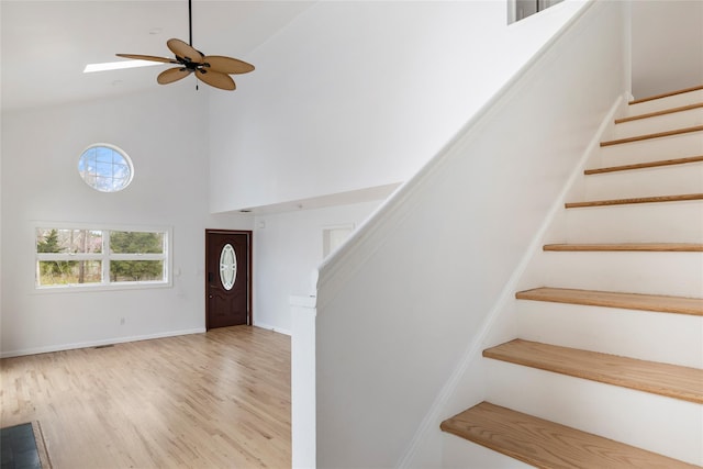 280 Shinnecock Hills Rd, Southampton, NY 11968 - foyer entrance featuring wood finished floors, baseboards, ceiling fan, high vaulted ceiling, and stairway
