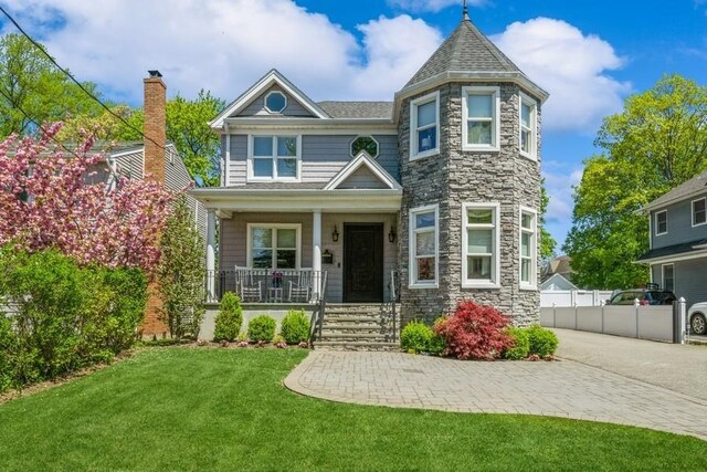 187 Lakeview Ave, Rockville Centre, NY 11570 - view of front of property featuring covered porch and stone siding