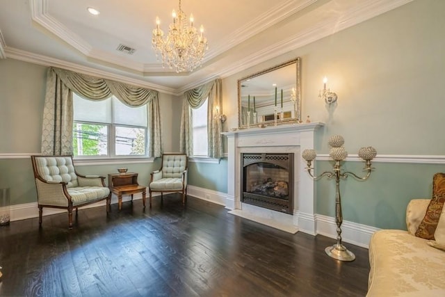 187 Lakeview Ave, Rockville Centre, NY 11570 - living area featuring a fireplace with flush hearth, wood-type flooring, a chandelier, baseboards, and ornamental molding