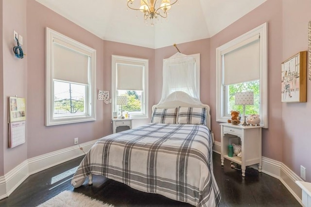 187 Lakeview Ave, Rockville Centre, NY 11570 - bedroom featuring wood finished floors, a chandelier, multiple windows, and vaulted ceiling
