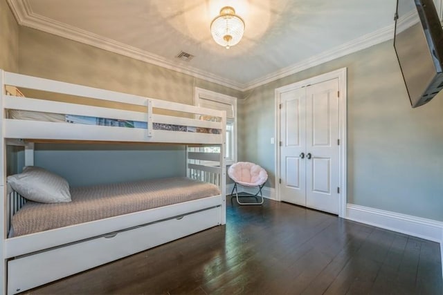 187 Lakeview Ave, Rockville Centre, NY 11570 - bedroom with dark wood-type flooring, baseboards, and crown molding