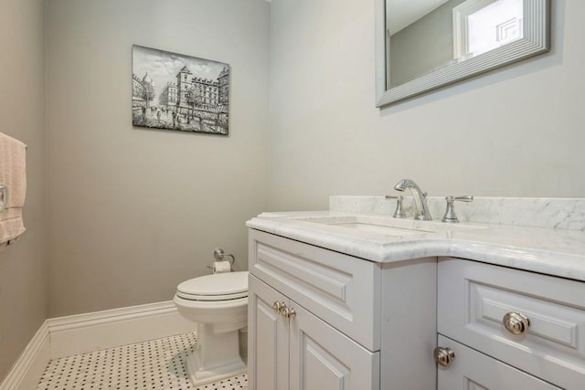 187 Lakeview Ave, Rockville Centre, NY 11570 - bathroom with vanity, toilet, and baseboards