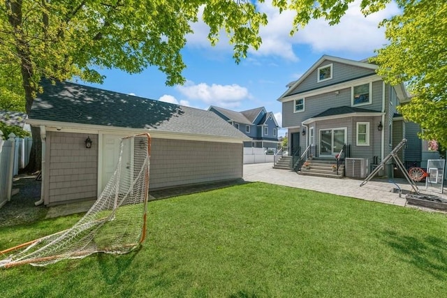 187 Lakeview Ave, Rockville Centre, NY 11570 - rear view of property with entry steps, a patio area, and central AC unit