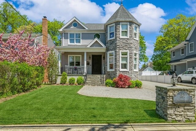 187 Lakeview Ave, Rockville Centre, NY 11570 - view of front of home featuring covered porch and stone siding