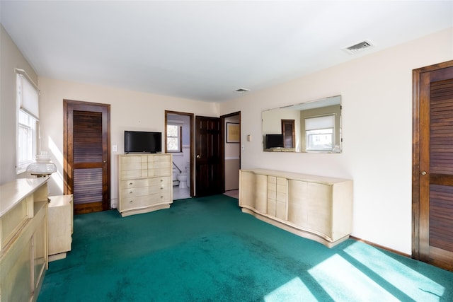 unfurnished living room with visible vents and carpet flooring