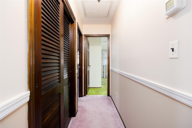 hallway featuring carpet and visible vents