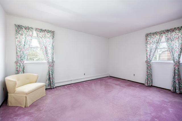 unfurnished room with carpet and a baseboard radiator