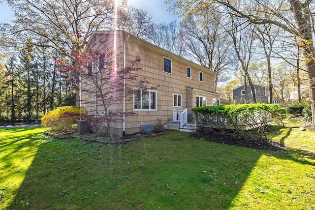 rear view of property with a lawn