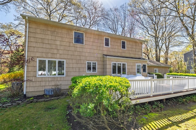 back of property featuring a deck