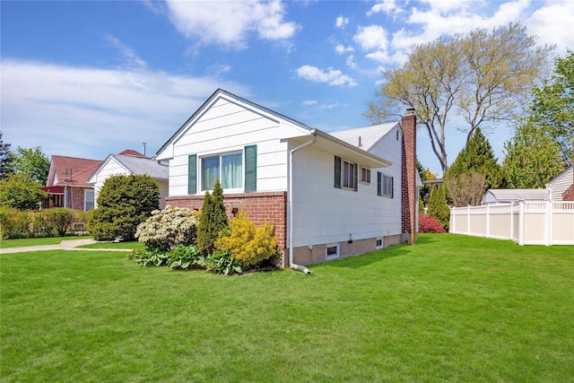1 Magenta St, Hicksville, NY 11801 - view of side of property featuring fence, a chimney, a lawn, and brick siding