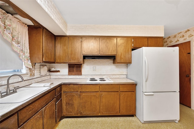 1 Magenta St, Hicksville, NY 11801 - kitchen featuring a sink, white appliances, light countertops, brown cabinetry, and tasteful backsplash
