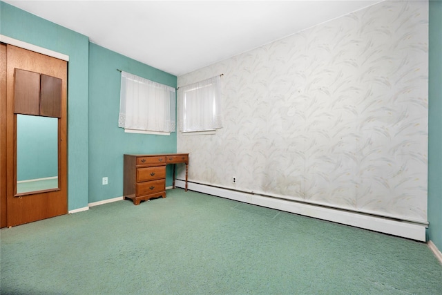 1 Magenta St, Hicksville, NY 11801 - unfurnished bedroom with baseboards, a baseboard heating unit, and carpet