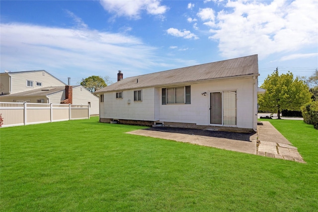 1 Magenta St, Hicksville, NY 11801 - back of property with a yard, fence, a chimney, and a patio area