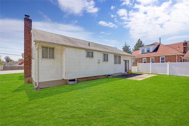 1 Magenta St, Hicksville, NY 11801 - back of property with fence, a yard, and a chimney
