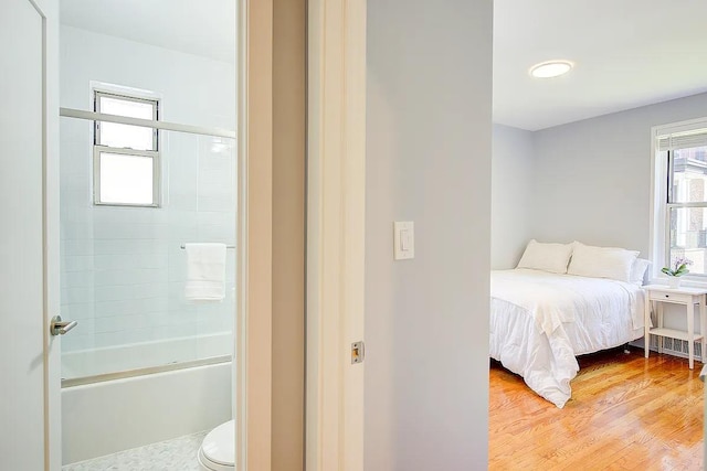 bedroom featuring light wood-style flooring