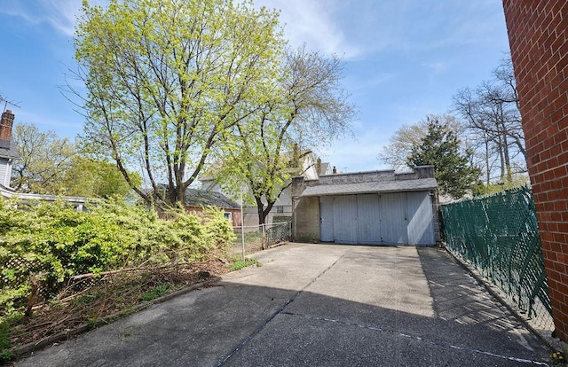 garage with fence