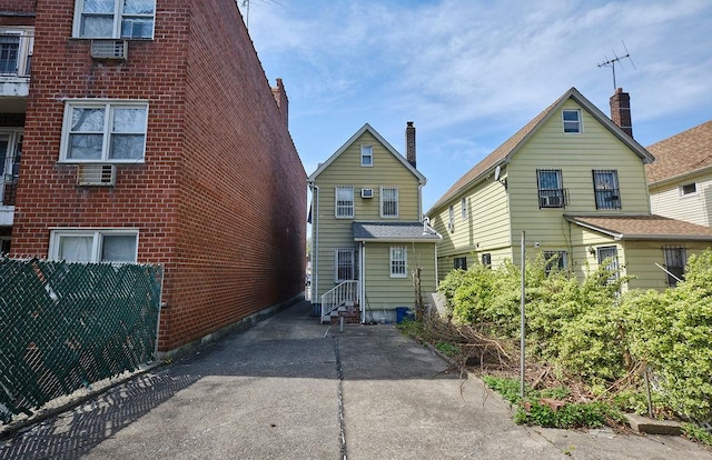back of property featuring entry steps