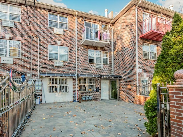 2027 Chatterton Ave, Bronx, NY 10472 - exterior space featuring fence, a patio area, and brick siding