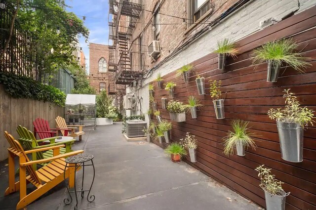 view of home's community featuring fence and a patio area