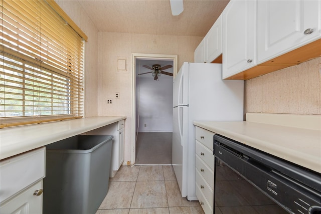 213-15 73rd Ave Lower, Lower, Oakland Gardens, NY 11364 - kitchen with black dishwasher, light countertops, white cabinets, a ceiling fan, and light tile patterned floors