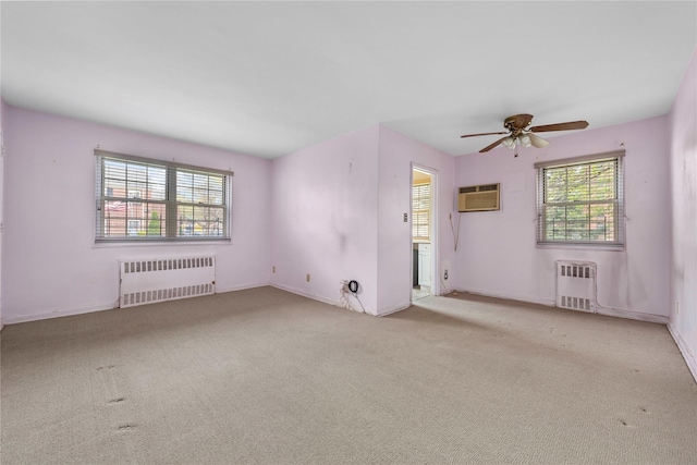 213-15 73rd Ave Lower, Lower, Oakland Gardens, NY 11364 - carpeted spare room featuring baseboards, ceiling fan, radiator heating unit, and a wall unit AC