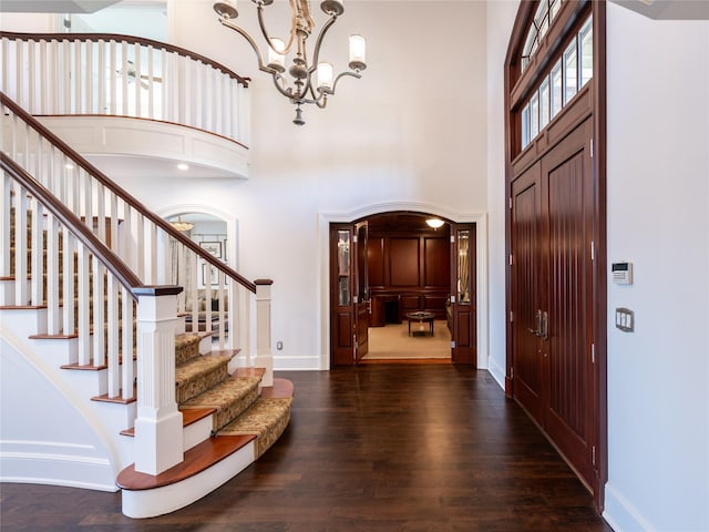 27 True Harbour Way W, Islip, NY 11795 - foyer with a towering ceiling, a chandelier, wood finished floors, stairs, and baseboards