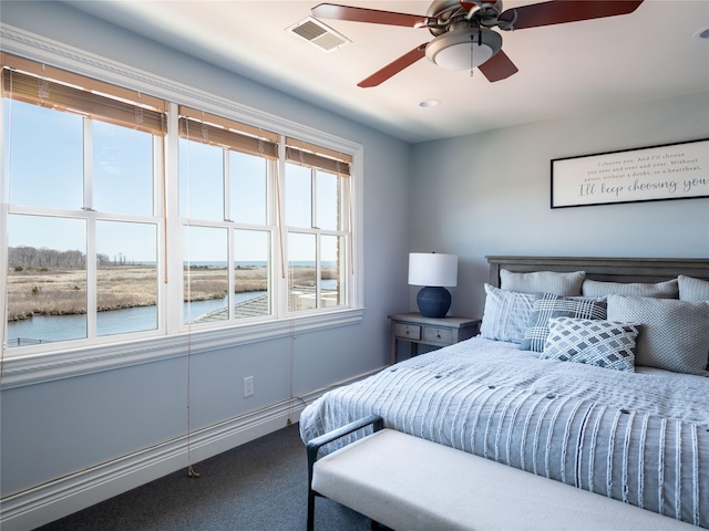 27 True Harbour Way W, Islip, NY 11795 - bedroom featuring a water view, carpet, and a ceiling fan