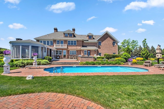 27 True Harbour Way W, Islip, NY 11795 - swimming pool featuring a sunroom, a patio area, and a yard