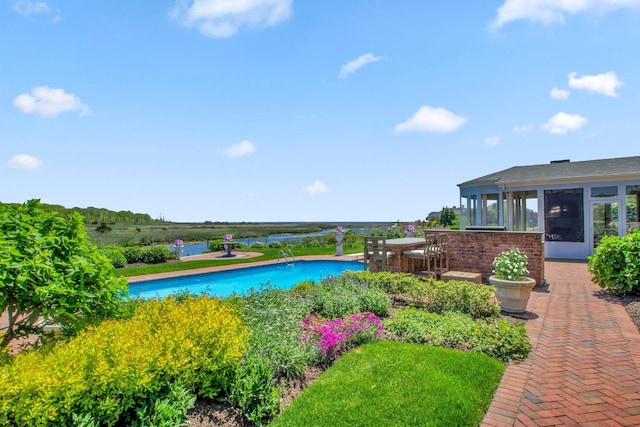 27 True Harbour Way W, Islip, NY 11795 - outdoor pool featuring a sunroom and a patio