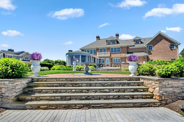 27 True Harbour Way W, Islip, NY 11795 - rear view of house with brick siding and a chimney