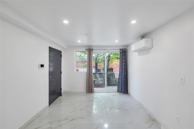 324 Ralph Ave, Brooklyn, NY 11233 - unfurnished room with an AC wall unit, recessed lighting, and light marble finish flooring