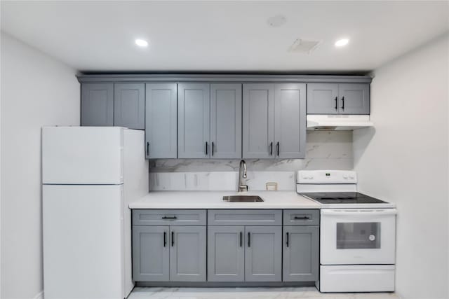 324 Ralph Ave, Brooklyn, NY 11233 - kitchen featuring white appliances, under cabinet range hood, gray cabinets, light countertops, and recessed lighting