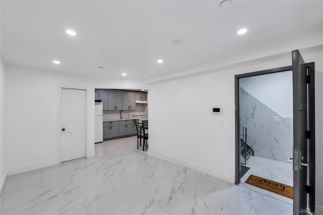 324 Ralph Ave, Brooklyn, NY 11233 - spare room with recessed lighting and light marble finish floors