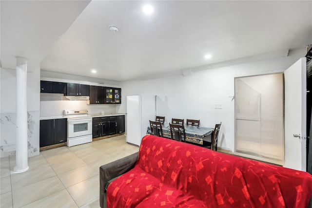 324 Ralph Ave, Brooklyn, NY 11233 - living room featuring light tile patterned flooring and recessed lighting
