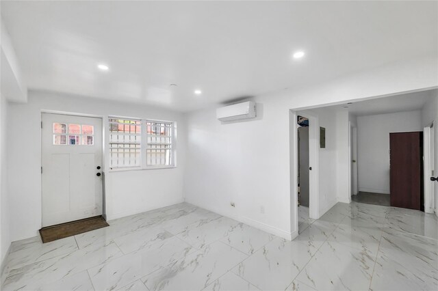 324 Ralph Ave, Brooklyn, NY 11233 - foyer with an AC wall unit, marble look tiles, and recessed lighting