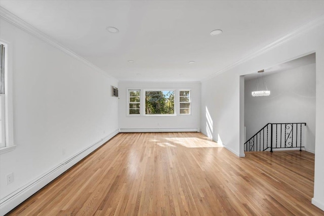 10 Mohawk Rd, Yonkers, NY 10710 - spare room featuring a baseboard heating unit, crown molding, a notable chandelier, and light wood finished floors