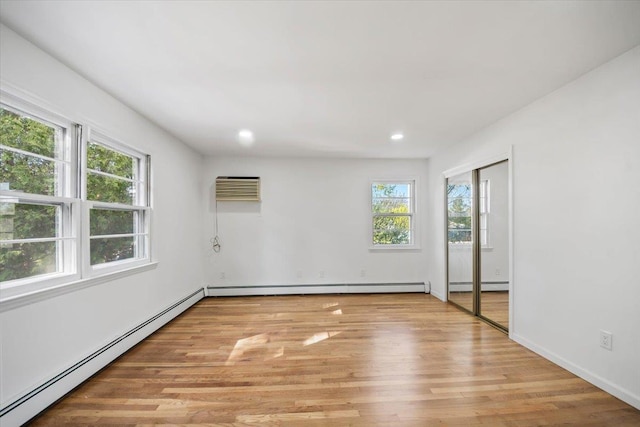 10 Mohawk Rd, Yonkers, NY 10710 - unfurnished room featuring light wood-style flooring, recessed lighting, and a baseboard radiator