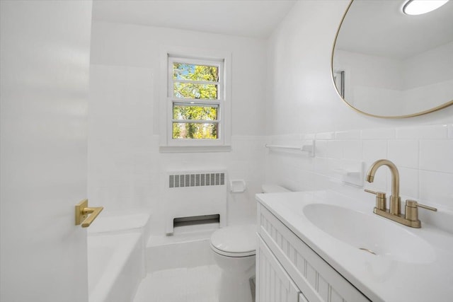 10 Mohawk Rd, Yonkers, NY 10710 - full bathroom with toilet, tile walls, a washtub, radiator heating unit, and vanity