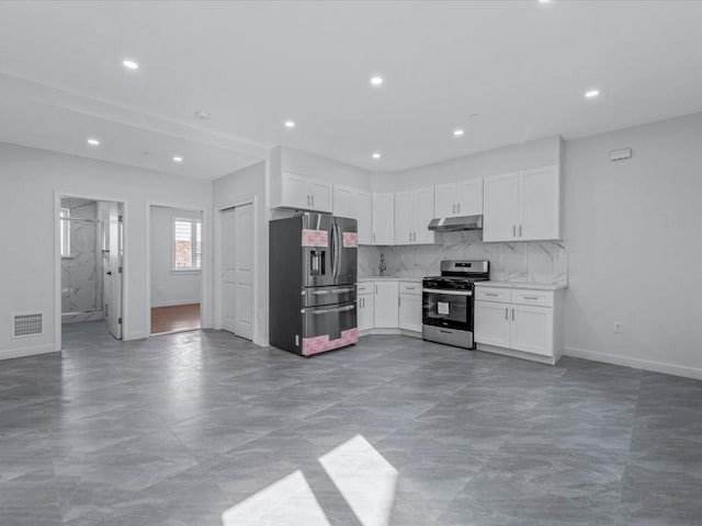 kitchen featuring visible vents, appliances with stainless steel finishes, light countertops, under cabinet range hood, and white cabinetry